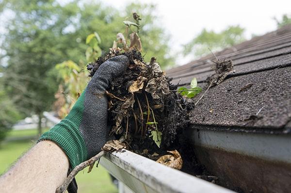 overflowing water, sagging gutters, and debris buildup are clear indicators that gutter cleaning is needed